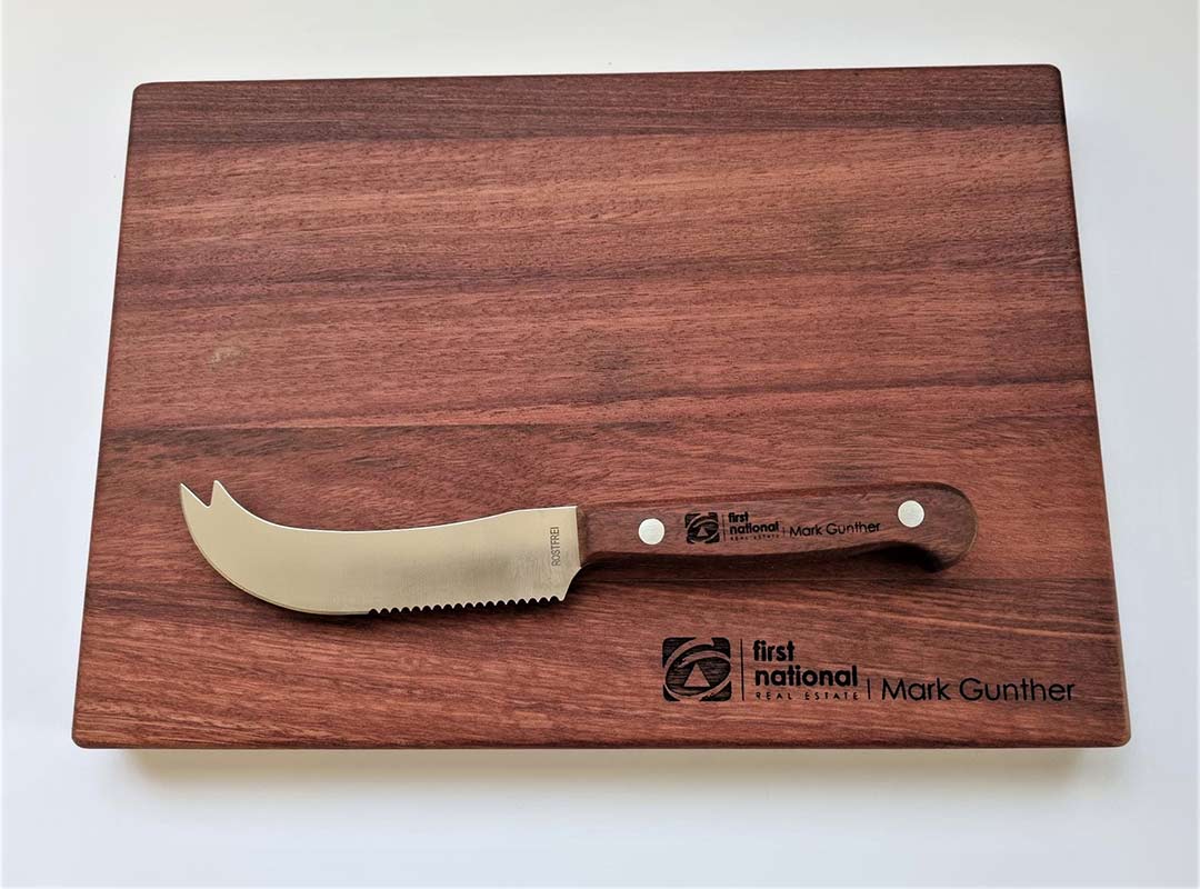 Engraved chopping board made of beautiful jarrah wood, used as a corporate gift for real estate.