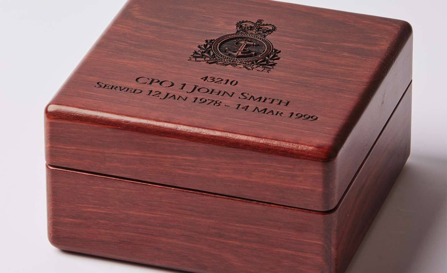 Beautiful, wooden medal display case engraved with canadian military emblem for veterans to store medals in.