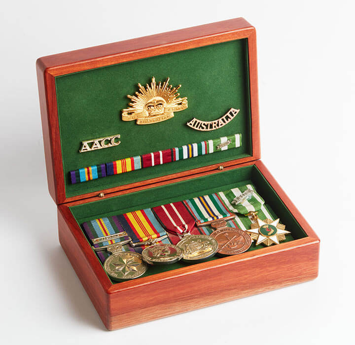 Medium sized medal boxes made from australian jarrah wood, with the lid open to show medals.