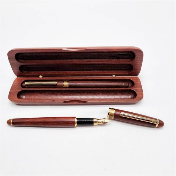 Wooden double pen set case with ballpoint pen inside and fountain pen lying in front.
