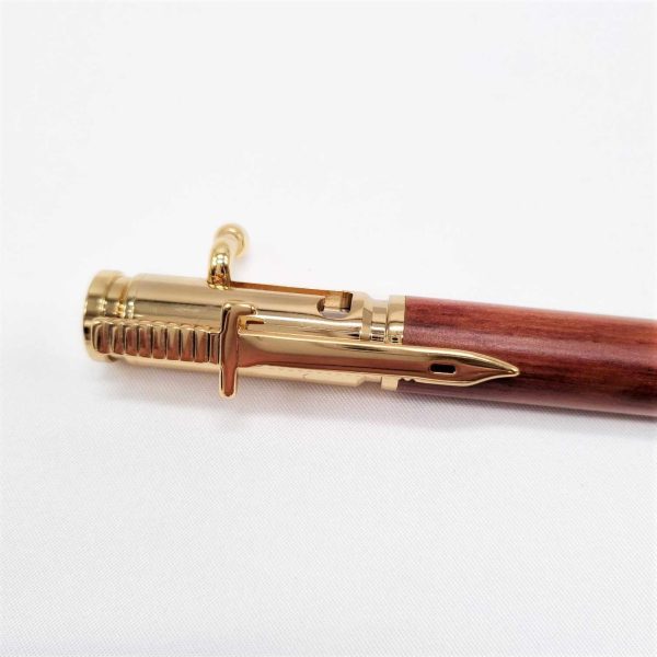 Wooden bullet pen with gold clip detail.